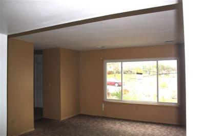 Living room with front door on the left