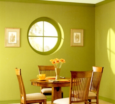 Yellow-green walls, window and trim in a dining room