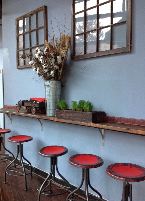 A vintage shade of blue on the wall with rustic wood accents