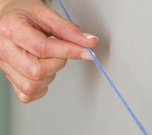 How to Snap a Chalk Line for Painting Wall Stripes