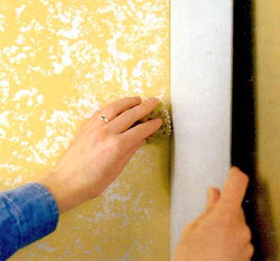 Use a cardboard as a shield for sponging in a corner