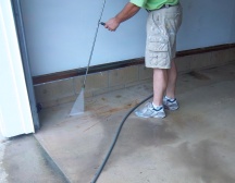 Power washing the floor before painting
