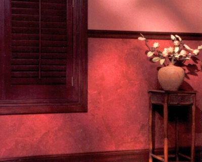 Faux "leather" or "parchment" wall paint treatment in shades of red