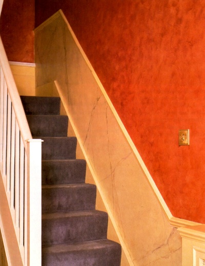 Deep red faux "suede" paint effect on hallway walls