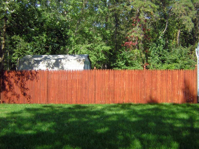 After: brightly stained fence