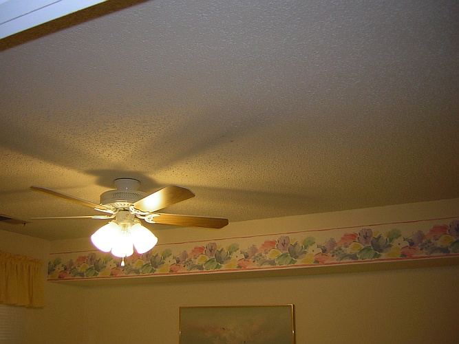 Before: crumbling popcorn ceiling needs to go