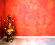 Gold and orange subtractive sponge painted finish