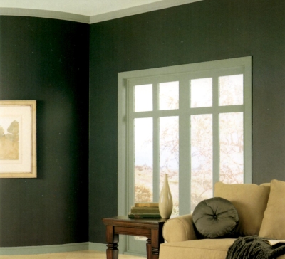 Different shades of green used on the walls and woodwork