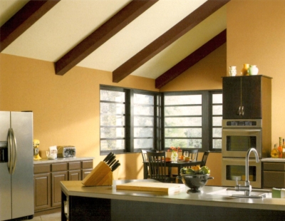 Black and brown trim color with warm neutral walls in a kitchen
