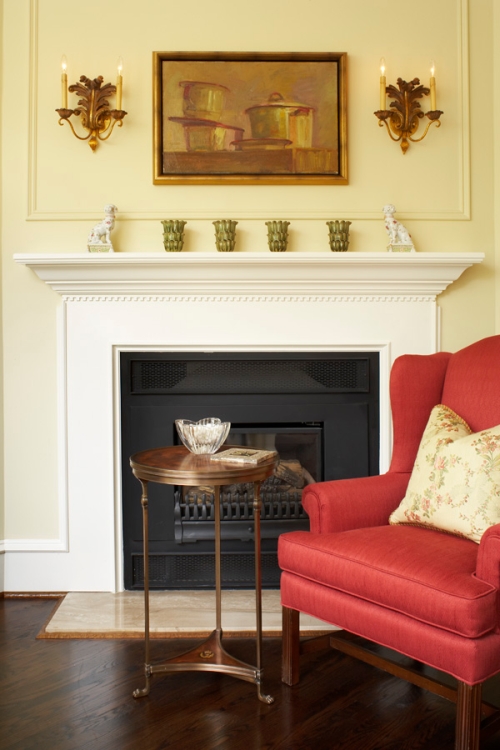 Yellow living room wall with a pop of red accent color