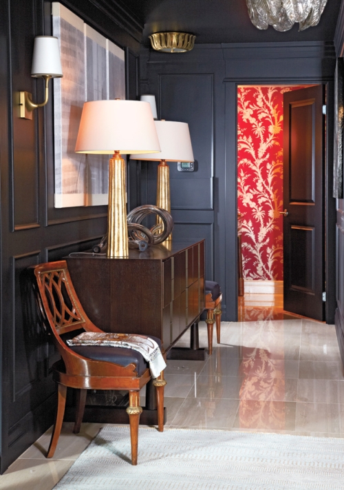 Navy blue wainscoted walls in a hallway