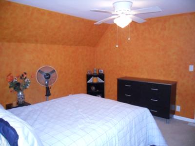 The 2 orange sponge painted walls