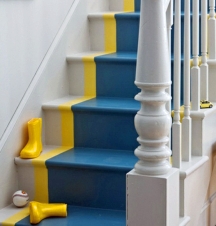 A wide painted strip of color on the stairs can look like a runner