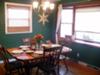 Country dining room painted a hunter green shade