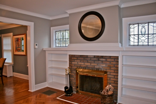 Gray family room next to the green dining room