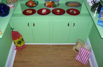 Another view of green painted cupboards