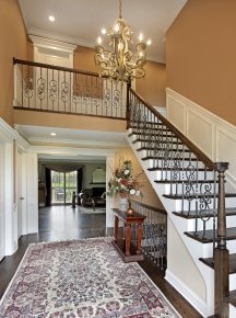 Contrast in colors makes large foyer walls look smaller
