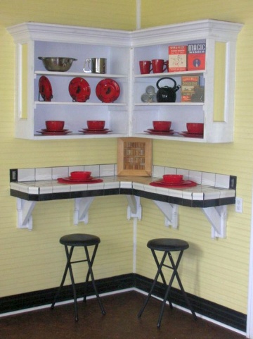 Bright yellow kitchen with red, white and black accents