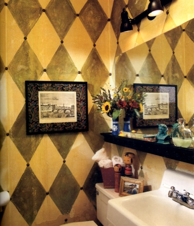 Harlequin style faux wall "tiles" painted in black and yellow and distressed with rags
