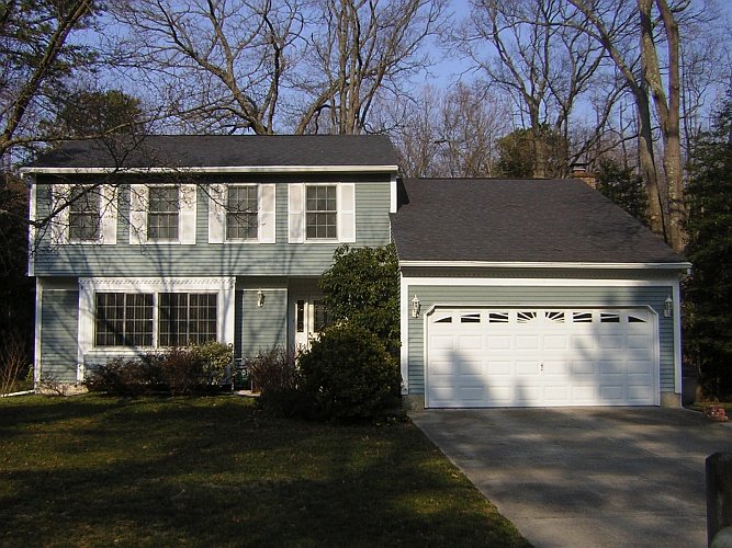Before: old fading aluminum siding
