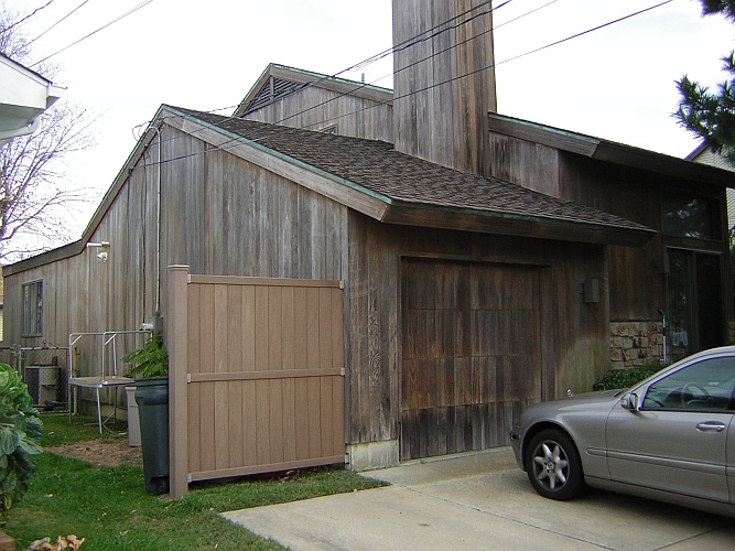 Before: wood panel house not stained in a long time