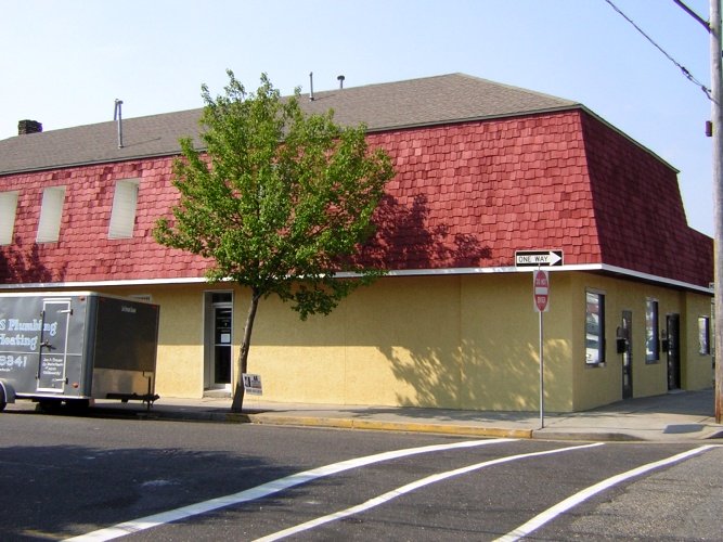 After: semi-transparent red stain on roof