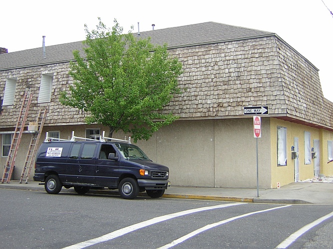 Before: bare wood roof shingles