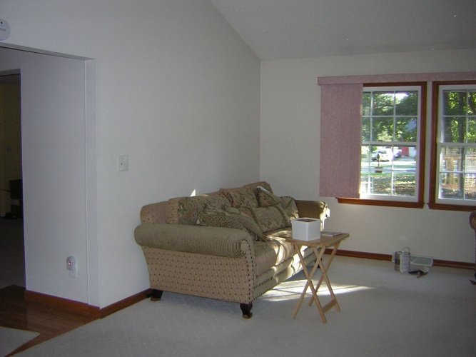 Before: blank walls in living room