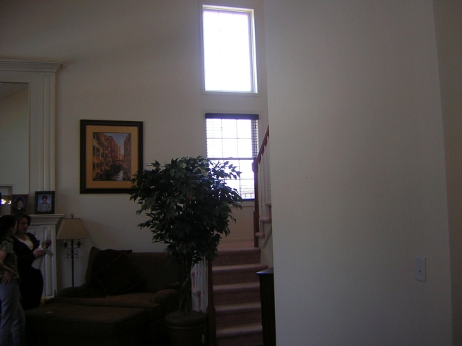 Before: spacious family room needs wall color