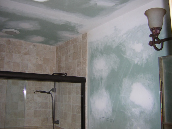 Before: unpainted drywall in shower