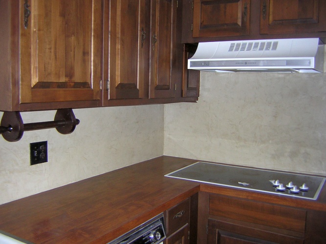 After: venetian plaster on backsplash looks like stone