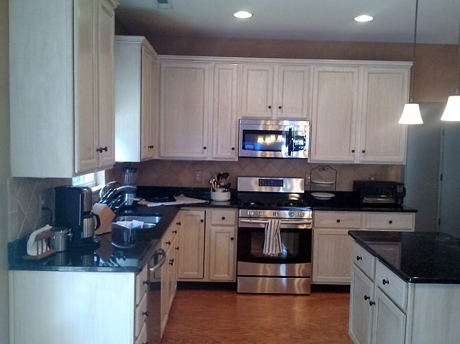 After: cabinets painted to look pickled