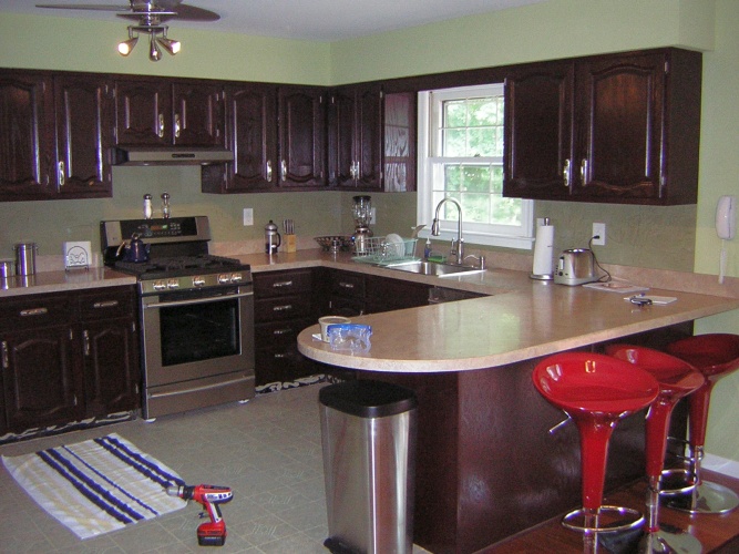After: cabinets in bold deep color look chic