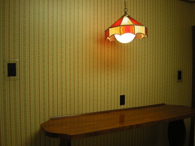 Before: dated wallpaper on kitchen walls