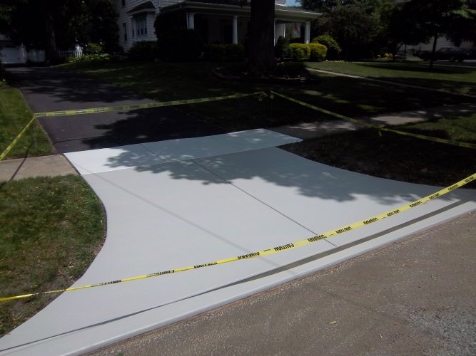 After: driveway painted neutral gray