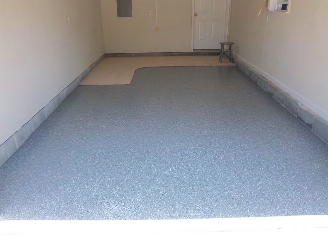 After: garage floor painted gray with flakes