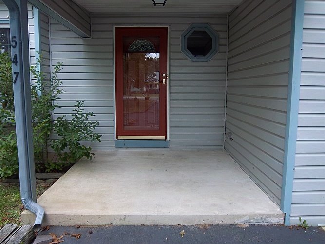 Before: dirty concrete porch