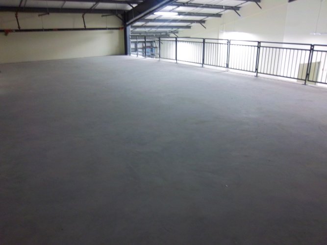 Before: unsealed concrete floor