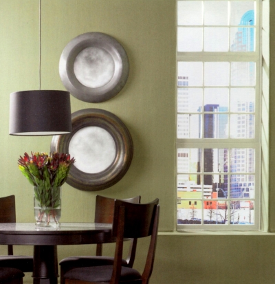 Green walls with tinted window trim in a dining room