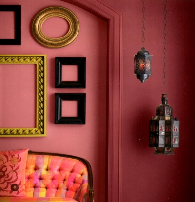 Deep pink trim and wall color with contrasting decor elements