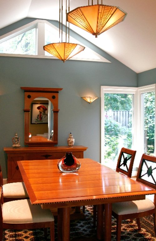 Contemporary dining room painted a muted blue-green color