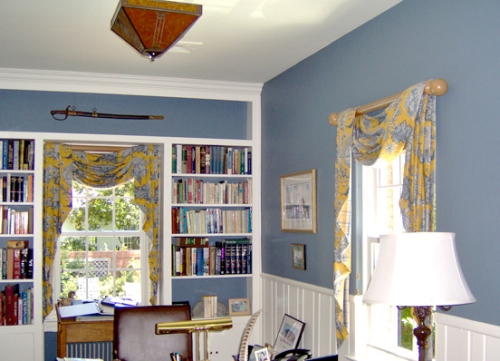 Home office with the upper walls painted a cloud blue color