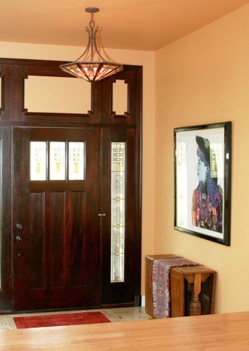 Asian inspired hallway with yellow ceiling and walls