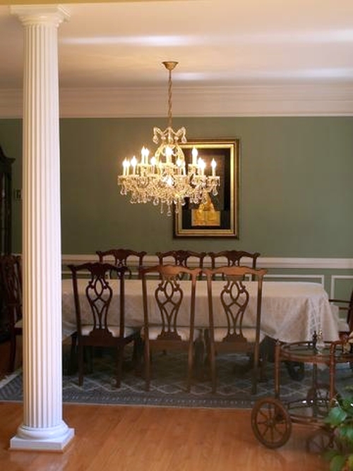 Formal dining room with the walls painted green