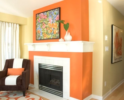 Pale yellow family room with an orange fireplace accent wall