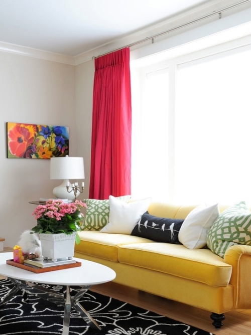 Greige painted room with red drapes and yellow couch