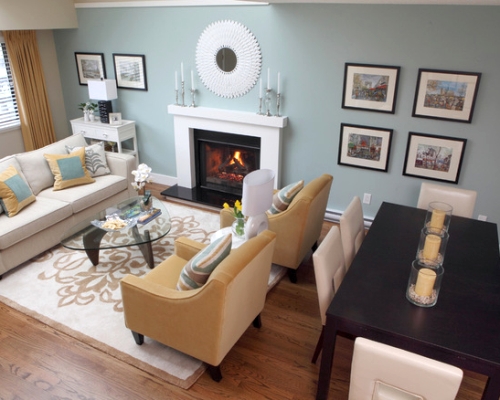 Living room with a french blue focal wall featuring a photo collection