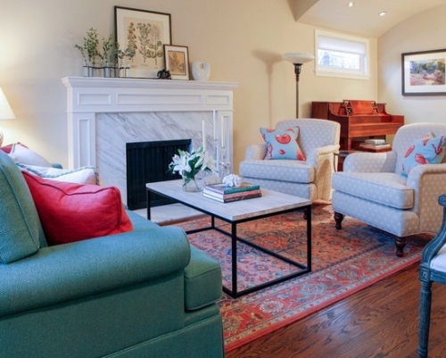 Beige living room with blue, green and red furniture and accents