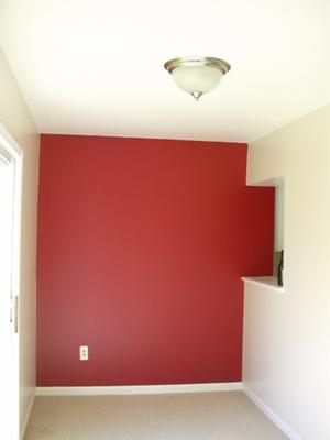 Vibrant red statement wall in my breakfast nook
