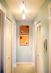 Draw attention to the end wall to make a long hallway seem shorter
